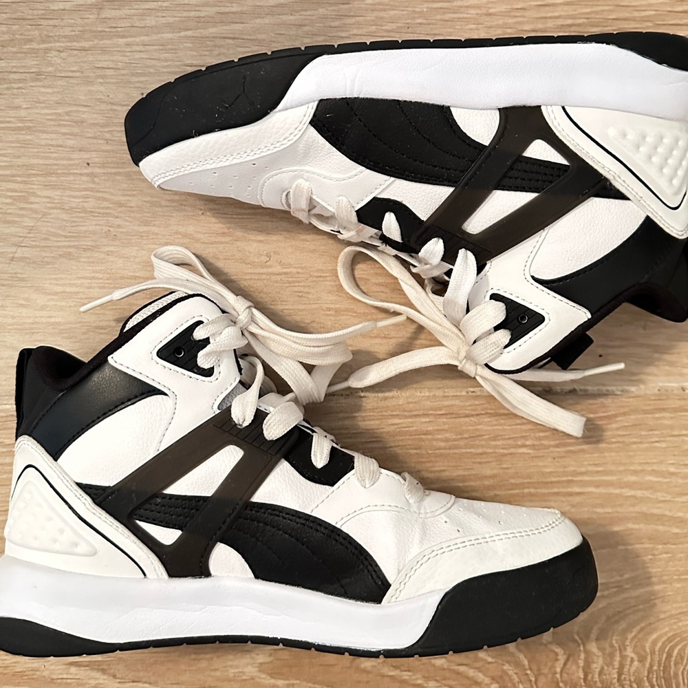 Black and white high top pumas